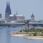 
              The river Rhine is pictured with low water in Cologne, Germany, Wednesday, Aug. 10, 2022. The low water levels are threatening Germany's industry as more and more ships are unable to traverse the key waterway. Severe drought will worsen in Europe in August as a hot and dry summer persists. (AP Photo/Martin Meissner)
            