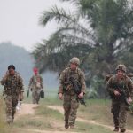 
              U.S. soldiers walk during annual joint combat exercises in Baturaja, South Sumatra province, Indonesia, Wednesday, Aug 3, 2022. The United States and Indonesian militaries began annual joint combat exercises Wednesday on Indonesia's Sumatra island, joined for the first time by partner nations, signaling stronger ties amid growing maritime activity by China in the Indo-Pacific region. (AP Photo)
            