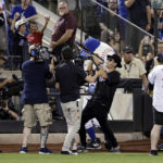 
              Musician Timmy Trumpet plays as New York Mets pitcher Edwin Diaz enters the team's baseball game against the Los Angeles Dodgers during the ninth inning Wednesday, Aug. 31, 2022, in New York. The Mets won 2-1. (AP Photo/Adam Hunger)
            