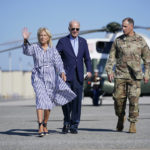 President Joe Biden and First Lady Jill Biden, walk to board Air Force One for a trip to Kentucky to view flood damage, Monday, Aug. 8, 2022, in Dover Air Force Base, Del. (AP Photo/Evan Vucci)
