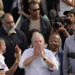 
              Brazil's former President Luiz Inacio Lula da Silva, who is running for reelection, blows kisses to supporters during a campaign rally outside the Volkswagen automaker´s plant in Sao Bernardo do Campo, greater Sao Paulo area, Brazil, Tuesday, Aug. 16, 2022. Brazil's general elections are scheduled for Oct. 2, 2022. (AP Photo/Andre Penner)
            