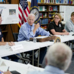 President Joe Biden participates in a briefing at Marie Roberts Elementary School about the ongoing response efforts to devastating flooding, Monday, Aug. 8, 2022, in Lost Creek, Ky. From left are Kentucky Gov. Andy Beshear, Biden, FEMA Administrator Deanne Criswell and Kentucky Lt. Gov. Jacqueline Coleman. (AP Photo/Evan Vucci)