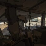 
              Palestinians inspect their house which was hit by an Israeli airstrike in Gaza City, Monday, Aug. 8, 2022. A cease-fire between Israel and Palestinian militants has taken effect late Sunday in a bid to end nearly three days of violence that has killed dozens of Palestinians. (AP Photo/Fatima Shbair)
            