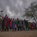
              People line up to vote at the Oltepesi Primary School in Kajiado County, Nairobi, Kenya, Tuesday, Aug. 9, 2022. Kenyans are voting to choose between opposition leader Raila Odinga and Deputy President William Ruto to succeed President Uhuru Kenyatta after a decade in power. (AP Photo/Ben Curtis)
            