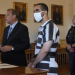 
              Hadi Matar, 24, center, listens to his public defense attorney Nathaniel Barone, left, addresses the judge while being arraigned in the Chautauqua County Courthouse in Mayville, NY., Saturday, Aug. 13, 2022. Matar, accused of carrying out a stabbing attack against “Satanic Verses” author Salman Rushdie, has entered a not-guilty plea on charges of attempted murder and assault. (AP Photo/Gene J. Puskar)
            