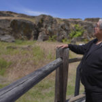 
              Wilbur Slockish Jr., a river chief of the Klickitat Band of the Yakama Nation, looks at petroglyphs in Columbia Hills Historical State Park on Saturday, June 18, 2022, in Lyle, Wash. In the 1980s, Slockish served 20 months in federal prison on charges of poaching salmon from the Columbia River. He says he went to prison to fight for his people's right to practice their faith. (AP Photo/Jessie Wardarski)
            