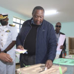 
              Kenya President Uhuru Kenyatta casts his vote at Mutomo Primary School, Gatundu, Central Kenya Tuesday Aug. 9, 2022, with leading candidates Raila.Odinga and William Ruto vying to become the new president of East Africa's economic hub. (AP Photo)
            