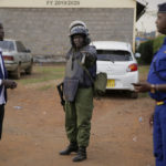 
              Kenyan police officers deploy to enforce the closing of polling stations during Kenya's general election in Eldoret, Kenya, Tuesday Aug. 9, 2022. Polls opened Tuesday in Kenya's unusual presidential election, where a longtime opposition leader who is backed by the outgoing president faces the deputy president who styles himself as the outsider. (AP Photo/Brian Inganga)
            