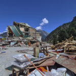 
              People salvage usable items from a damaged hotel building caused by floodwaters, in Kalam in Swat Valley, Pakistan, Tuesday, Aug. 30, 2022. Disaster officials say nearly a half million people in Pakistan are crowded into camps after losing their homes in widespread flooding caused by unprecedented monsoon rains in recent weeks. (AP Photo/Sherin Zada)
            