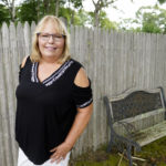 
              Diane Panicucci, of West Warwick, R.I., poses for a photograph in the yard of her home, Wednesday, Aug. 10, 2022, in West Warwick. Panicucci believes climate change is happening and that it needs to be addressed. But for her, it's a lower priority compared with other issues, including inflation and food and drug costs. (AP Photo/Steven Senne)
            