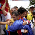 
              Men enacting as independence heroes Simon Bolivar and Francisco de Paula Santander embrace during an event organized by supporters of Colombia's new President Gustavo Petro in San Antonio, Venezuela, Sunday, Aug. 7, 2022. Colombia's incoming foreign minister and his Venezuelan counterpart announced in late July that the border, partially closed since 2015, will gradually reopen after the two nations restore diplomatic ties when Colombia's new president is sworn-in on Aug. 7. (AP Photo/Matias Delacroix)
            
