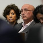 
              Robert E. Crimo III's mother Denise Pesina, left, and father Robert Crimo Jr., attend to a hearing for their son in Lake County court Wednesday, Aug. 3, 2022, in Waukegan, Ill. Crimo III, accused of killing seven people and wounding dozens more in a shooting at an Independence Day parade in suburban Chicago pleaded not guilty on Wednesday, a week after prosecutors announced he faces 117 felony counts in the attack. (AP Photo/Nam Y. Huh, Pool)
            