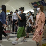 
              Commuters walk through a subway station during the morning rush hour in the central business district in Beijing, Tuesday, Aug. 9, 2022. China's 11 million university graduates are struggling in a bleak job market this summer as repeated shutdowns under China's anti-COVID lockdowns forced companies to retrench and driven many restaurants and other small employers out of business. (AP Photo/Mark Schiefelbein)
            