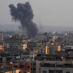 
              Smoke rises after Israeli airstrikes on residential building in Gaza, Saturday, Aug. 6, 2022. (AP Photo/Adel Hana)
            