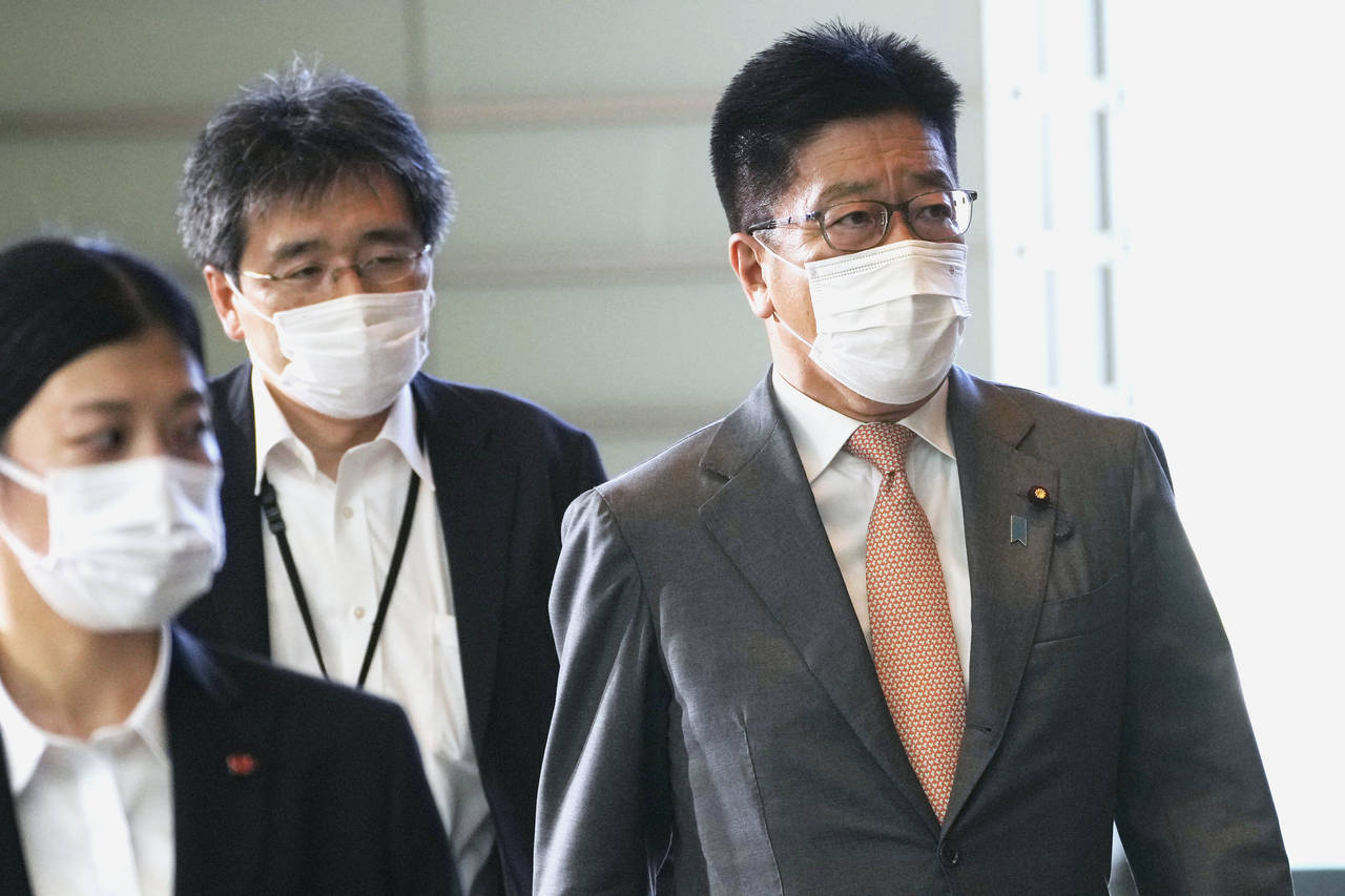 Newly appointed Minister of Health, Labour and Welfare Katsunobu Kato, right, arrives at the prime ...