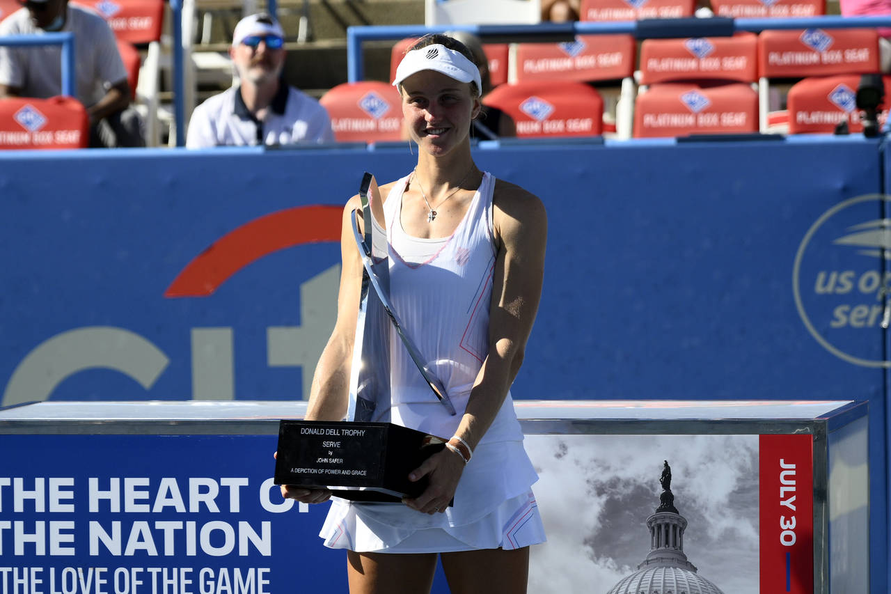 Liudmila Samsonova, of Russia, poses with the trophy after she won the final at the Citi Open tenni...
