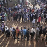 
              People line up to cast their vote in Kenya's general election in Eldoret, Kenya, Tuesday Aug. 9, 2022. Kenyans are voting to choose between opposition leader Raila Odinga Deputy President William Ruto to succeed President Uhuru Kenyatta after a decade in power. (AP Photo/Brian Inganga))
            