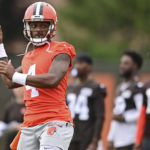 
              FILE - Cleveland Browns quarterback Deshaun Watson throws during NFL football practice in Berea, Ohio, Sunday, Aug. 14, 2022. A person familiar with the situation tells The Associated Press on Thursday, Aug. 18, 2022, that Watson has reached a settlement with the NFL and will serve an 11-game suspension and pay a $5 million fine rather than risk missing his first season as quarterback of the Browns following accusations of sexual misconduct while he played for the Houston Texans. (AP Photo/David Dermer, File)
            