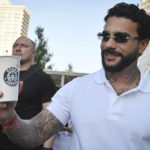 
              Russian singer and entrepreneur Timur Yunusov, better known as Timati, poses in front of a newly opened Stars Coffee coffee shop in the former location of the Starbucks coffee shop in Moscow, Russia, Thursday, Aug. 18, 2022. A new chain of coffee shops opens Thursday in Moscow, after Russian singer and entrepreneur Timur Yunusov, better known as Timati, together with Russian restaurateur Anton Pinskiy bought the Starbucks stores following company's withdrawal from Russia. (AP Photo/Dmitry Serebryakov)
            