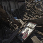 
              Icons lay on the debris of a church which was destroyed after Russian attack at the frontline in Mykolaiv region, Ukraine, on Monday, Aug. 8, 2022. (AP Photo/Evgeniy Maloletka)
            