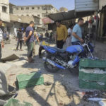 
              This photo provided by the Syrian Civil Defense White Helmets, which has been authenticated based on its contents and other AP reporting, shows Syrian residents check a market the attacked by rockets, at al-Bab town, north Syria, Friday, Aug. 19, 2022. A rocket attack on a crowded market in a town held by Turkey-backed opposition fighters in northern Syria Friday killed several people and wounded dozens, an opposition war monitor and a paramedic group reported. (Syrian Civil Defense White Helmets via AP)
            