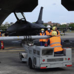 FILE - Ground crew prepare an AIM-120 advanced medium range air-to-air missile on a F16V fighter jet at the Hualien Airbase in southeastern Taiwan, Wednesday, Aug. 17, 2022. Experts say a lot can be gleaned from what China has done, and not done, in the large-scale military exercises it held in response to U.S. House Speaker Nancy Pelosi's visit to Taiwan, followed by Taiwan's own drills and Beijing announcing more maneuvers planned. (AP Photo/Johnson Lai, File)