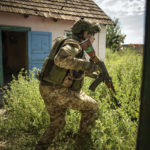 
              A Ukrainian serviceman of "Fireflies" reconnaissance team takes his position at the frontline in Mykolaiv region, Ukraine, on Monday, Aug. 8, 2022. (AP Photo/Evgeniy Maloletka)
            