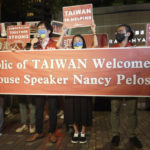 
              FILE - Supporters hold a banner outside the hotel where U.S. House Speaker Nancy Pelosi is to be staying in Taipei, Taiwan, Tuesday, Aug 2, 2022. Experts say a lot can be gleaned from what China has done, and not done, in the large-scale military exercises it held in response to U.S. House Speaker Nancy Pelosi's visit to Taiwan, followed by Taiwan's own drills and Beijing announcing more maneuvers planned. (AP Photo/Chiang Ying-ying, File)
            