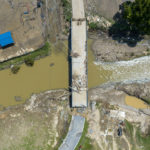 FILE - A bridge along KY-3351 over Troublesome Creek near Ary in Perry County, Ky., remains damaged Tuesday, Aug. 2, 2022, following flooding the week before that devastated many counties in Eastern Kentucky. (Ryan C. Hermens/Lexington Herald-Leader via AP, File)