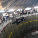 
              Zoran Milojkovic rides a motorcycle on the "Wall of Death", also known as a motordrome or silodrome, during the motorcycle rally in Belgrade, Serbia, Thursday, Aug. 18, 2022. Motorcycle enthusiasts in Belgrade were in for a trip down the memory lane last week when near-forgotten Well of Death stunt show came to town (AP Photo/Darko Vojinovic)
            