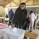 
              A woman casts her vote in Kenya's general election in Sugoi, 50 kms (35 miles) north west of Eldoret, Kenya, Tuesday Aug. 9, 2022. Kenyans are voting to choose between opposition leader Raila Odinga Deputy President William Ruto to succeed President Uhuru Kenyatta after a decade in power. (AP Photo/Brian Inganga)
            