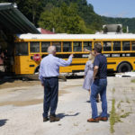 
              President Joe Biden, first lady Jill Biden, Kentucky Gov. Andy Beshear, right, and Rep. Hal Rogers, R-Ky., left, view flood damage, Monday, Aug. 8, 2022, in Lost Creek, Ky., where a bus floated into a building. (AP Photo/Evan Vucci)
            