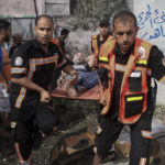 
              Members of Palestinian Civil Defense evacuate a wounded man following an explosion in Jebaliya refugee camp, northern Gaza Strip, Sunday, Aug. 7, 2022. On Sunday, a projectile hit a home in Jebaliya, killing two men. Palestinians held Israel responsible, while Israel said it was investigating whether the area was hit by an errant rocket. (AP Photo/Ahmad Hasaballah)
            