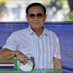 
              FILE - Thailand's Prime Minister Prayuth Chan-ocha casts his vote at a polling station in Bangkok, Thailand, Sunday, March 24, 2019, during the nation's first general election since the military seized power in a 2014 coup. Thailand's Constitutional Court suspended Prayuth from his duties on Wednesday, Aug. 25, 2022, while it decides whether he violated the country's term limits, potentially opening a new chapter of turmoil in the nation's troubled politics. (AP Photo/Gemunu Amarasinghe, File)
            