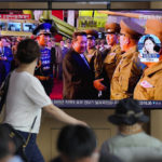 
              A TV screen showing a news program reporting about North Korea's missile launch with a file footage of North Korean leader Kim Jong Un, is seen at the Seoul Railway Station in Seoul, South Korea, Wednesday, Aug. 17, 2022. South Korean President Yoon Suk Yeol said Wednesday his government has no plans to pursue its own nuclear deterrent in the face of growing North Korean nuclear weapons capabilities, even as the North fired two suspected cruise missiles toward the sea in the latest display of an expanding arsenal. (AP Photo/Lee Jin-man)
            