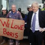 
              FILE - Britain's Prime Minister Boris Johnson poses with workers during a visit to Wilton Engineering Services, part of a General Election campaign trail stop in Middlesbrough, England, Wednesday, Nov. 20, 2019. The moving vans have already started arriving in Downing Street, as Britain's Conservative Party prepares to evict Johnson. Debate about what mark he will leave on his party, his country and the world will linger long after he departs in September. (AP Photo/Frank Augstein, Pool, File)
            