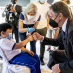 
              Secretary of State Antony Blinken, right, fists bumps with Danielle James, 6, after he gets a COVID-19 vaccination at a clinic at the Manila Zoo in Manila, Philippines, Saturday, Aug. 6, 2022. Blinken is on a ten-day trip to Cambodia, Philippines, South Africa, Congo, and Rwanda. (AP Photo/Andrew Harnik, Pool)
            