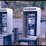 
              Two disconnected pay phones stand near the post office in Bisbee, Ariz., Oct. 26, 2021. In 1995, The Church of Jesus Christ of Latter-day Saints established a “help line” for bishops and other church leaders seeking guidance on reporting allegations of child sexual abuse. But help line calls are often referred to a law firm that represents the church and is responsible for alerting the church to potentially costly sexual abuse lawsuits. In the case of Paul Adams, who repeatedly raped his two daughters, a bishop called the help line and was told to keep the abuse secret, because Adams admitted to the abuse during confession. (AP Photo/Dario Lopez-Mills)
            