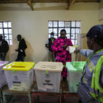 
              Residents line up to vote at the Oltepesi Primary School in Kajiado County of Nairobi, Kenya, Tuesday, Aug. 9, 2022. Kenyans are voting to choose between opposition leader Raila Odinga and Deputy President William Ruto to succeed President Uhuru Kenyatta after a decade in power. (AP Photo/Ben Curtis)
            