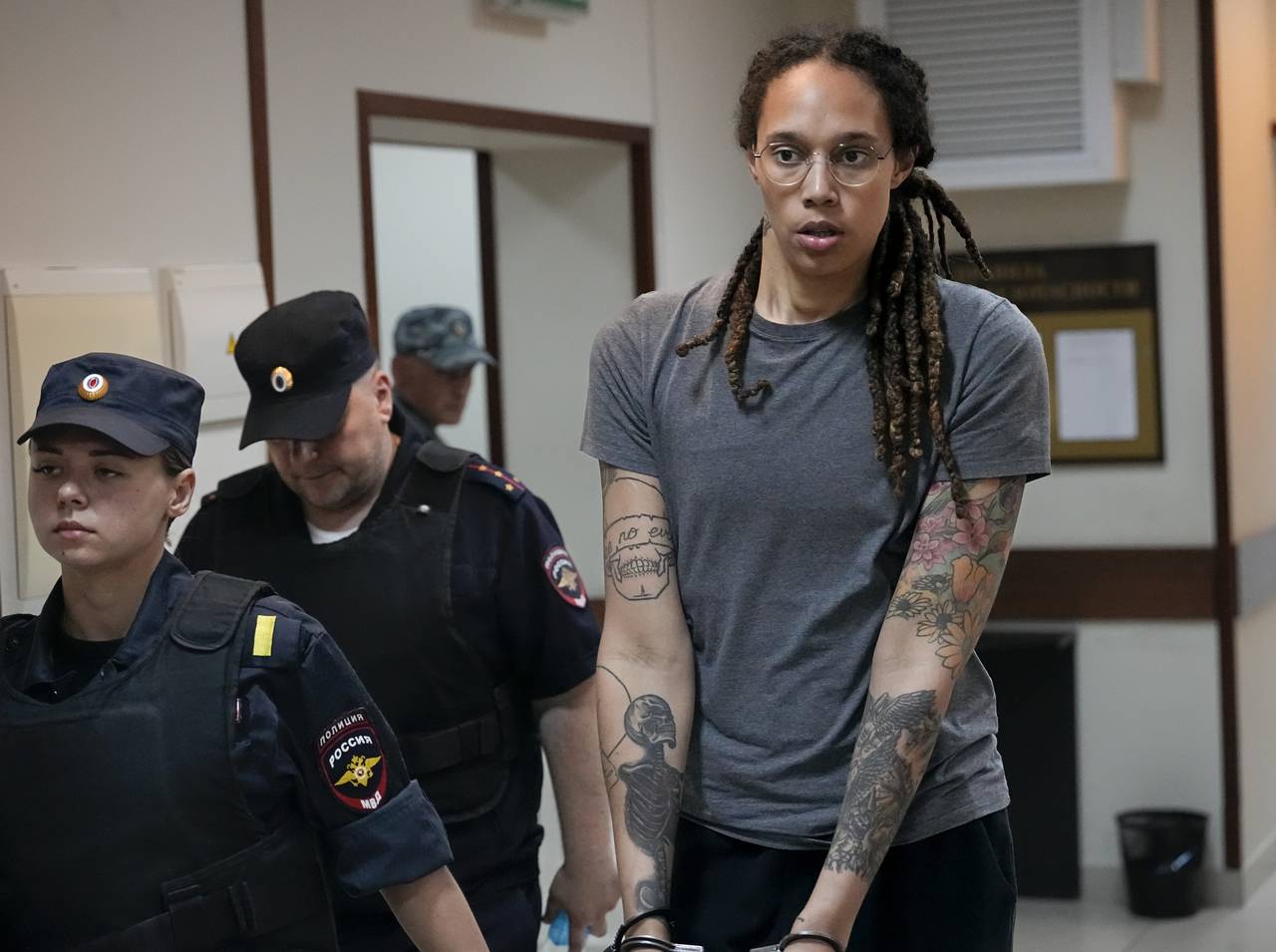 WNBA star and two-time Olympic gold medalist Brittney Griner is escorted from a court room ater a h...