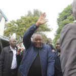 
              Kenya's President Uhuru Kenyatta waves to the crowd after casting his vote at Mutomo Primary School, Gatundu, Central Kenya Tuesday Aug. 9, 2022, with leading candidates Raila.Odinga and William Ruto vying to become the new president of East Africa's economic hub. (AP Photo)
            