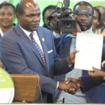 
              The Independent and Electoral Boundaries Commission (IEBC) Chairman, Wafula Chebukati, left, presents a certificate to William Ruto, after the announcement of the results of the presidential race at the Centre in Bomas, Nairobi, Kenya, Monday, Aug. 15, 2022. Kenya’s electoral commission chairman has declared Deputy President William Ruto the winner of the close presidential election over five-time contender Raila Odinga, a triumph for the man who shook up politics by appealing to struggling Kenyans on economic terms and not on traditional ethnic ones. (AP Photo/Sayyid Abdul Azim)
            