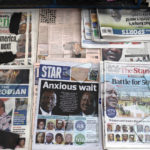 
              A newspaper stand shows daily publications as they follow the vote-tallying in Nairobi, Kenya, Friday, Aug. 12, 2022. Vote-tallying in Kenya's close presidential election isn't moving fast enough, the electoral commission chair said Friday, while parallel counting by local media dramatically slowed amid concerns about censorship or meddling. (AP Photo/Mosa'ab Elshamy)
            