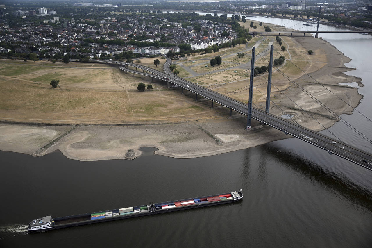 A cargo ship is sailing on the Rhine in Duesseldorf, Germany, Monday, Aug. 15, 2022. Due to the ong...