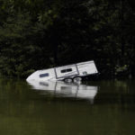 FILE - A camper is seen partly submerged under water in Carr Creek Lake on Aug. 3, 2022, near Hazard, Ky. (AP Photo/Brynn Anderson, File)