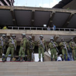 
              Soldiers stand outside the campaign headquarters of Kenyan presidential candidate Raila Odinga in downtown Nairobi, Kenya, Tuesday, Aug. 16, 2022. Kenya is calm a day after Deputy President William Ruto was declared the winner of the narrow presidential election over longtime opposition figure Raila Odinga. (AP Photo/Mosa'ab Elshamy)
            