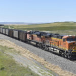 
              FILE - A BNSF railroad train hauling carloads of coal from the Powder River Basin of Montana and Wyoming is seen east of Hardin, Mont., on July 15, 2020. The head of the nation's largest railroad union says the report designed to help resolve stalled contract talks with freight railroads didn't do enough to address concerns about working conditions even though it recommended 24% raises, Thursday, Aug. 18, 2022. (AP Photo/Matthew Brown, File)
            