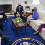 
              FILE - President Joe Biden speaks during a meeting in the Oval Office of the White House, May 13, 2021, in Washington. From left, Secretary of Transportation Secretary Pete Buttigieg, Sen. Mike Crapo, R-Idaho, Vice President Kamala Harris, Biden, Sen. Shelley Moore Capito, R-W.Va., and Commerce Secretary Gina Raimondo. (AP Photo/Evan Vucci, File)
            