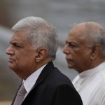 
              Sri Lankan President Ranil Wickremesinghe, left, inspects a guard of honour after delivering his policy speech at the parliament as prime minister Dinesh Gunawardena stands by him in Colombo, Sri Lanka, Wednesday, Aug. 3, 2022. (AP Photo/Eranga Jayawardena)
            