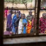 
              Maasai wait in line to cast their votes in the general election at a polling station in Esonorua Primary School, in Kajiado County, Kenya Tuesday, Aug. 9, 2022. Polls opened Tuesday in Kenya's unusual presidential election, where a longtime opposition leader who is backed by the outgoing president faces the deputy president who styles himself as the outsider. (AP Photo/Ben Curtis)
            